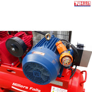 Close-up of the ACB75150E blue motor with orange industrial plug mounted on the red tank.