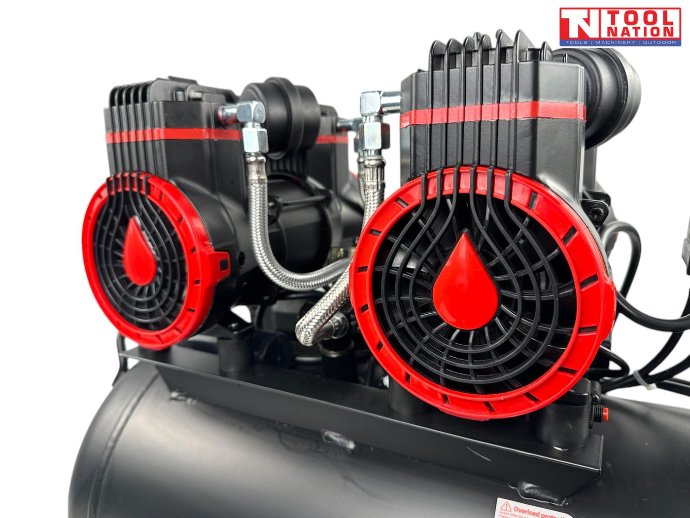 Close-up of the four oil-free pump units mounted on the air compressor tank.