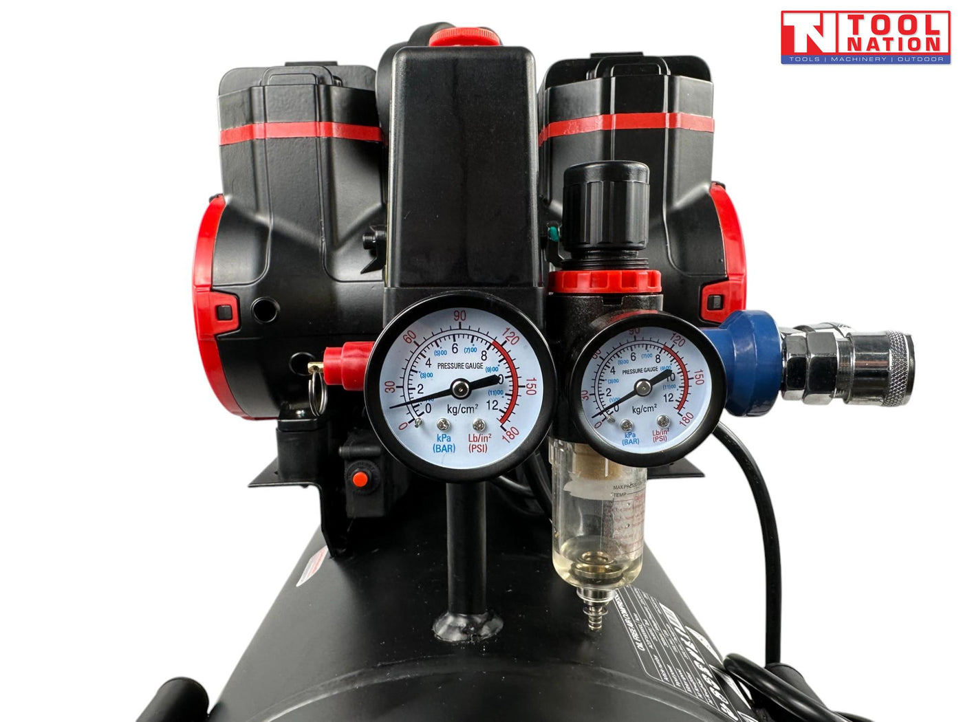 Close-up of the regulator, dual pressure gauges, outlet fitting and filter bowl on the oil-free air compressor.