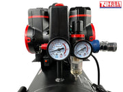 Close-up of the regulator, dual pressure gauges, outlet fitting and filter bowl on the oil-free air compressor.