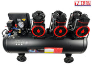 Front angled view of the oil-free air compressor showing six pump units, three motors, control panel, handle and 100 litre tank.