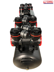 End view of the oil-free air compressor showing eight pump units mounted in two rows above the black tank.