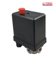 Front angled view of the ACS3-3PH air compressor pressure switch showing the black housing, red switch button and four-port silver base.