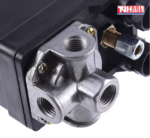 Close-up of the ACS3-3PH pressure switch four-port silver base with threaded ports and attached fitting.