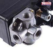 Close-up of the ACS3-3PH pressure switch four-port silver base with threaded ports and attached fitting.