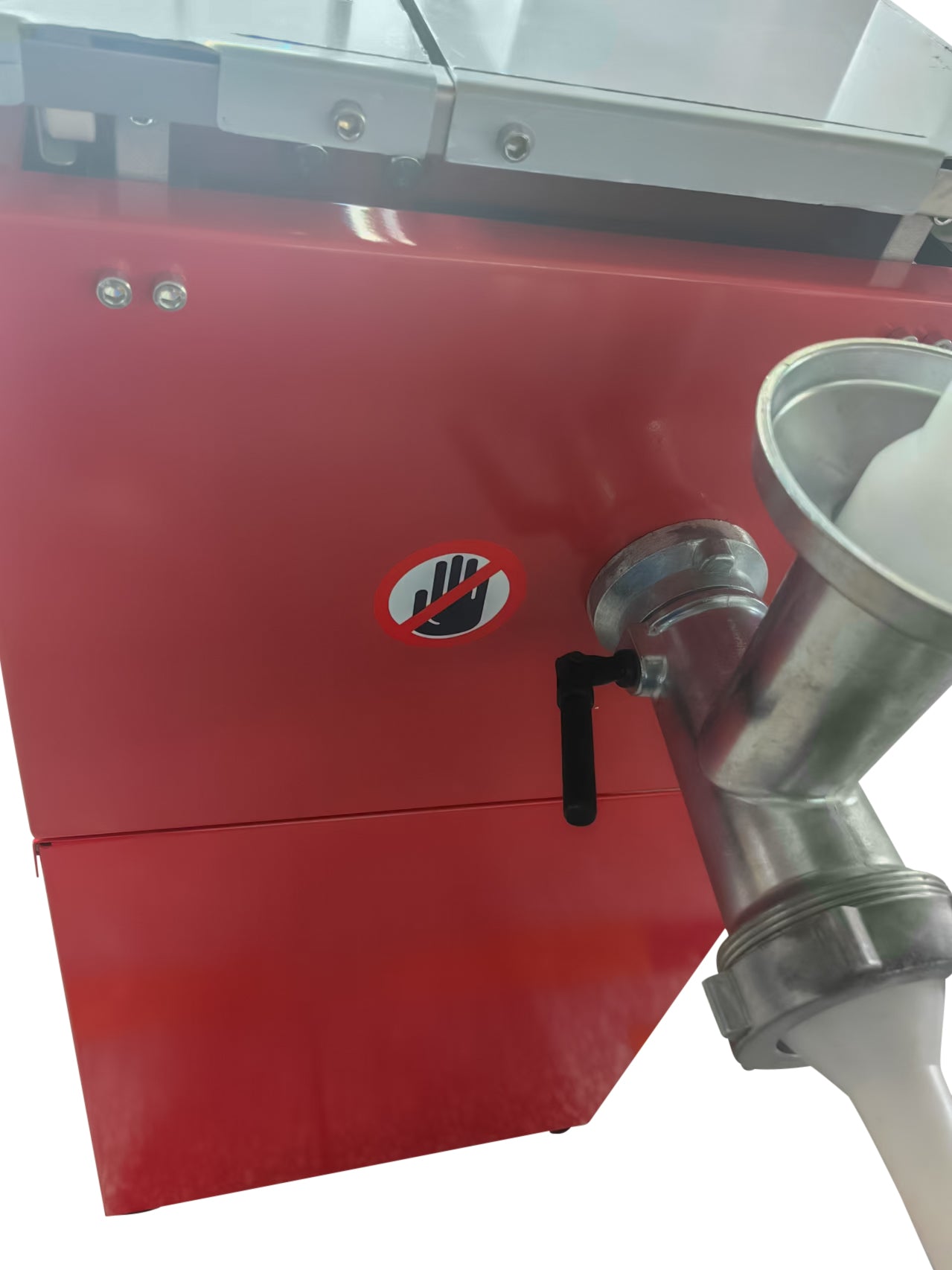 Close-up of a red bandsaw body showing a stainless grinder attachment, white pusher, warning sticker, bolts, and part of the work table.