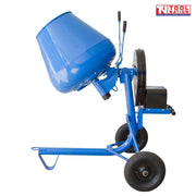 Blue cement mixer with open drum, frame, wheels, handles, black motor housing, and logo in the top corner.