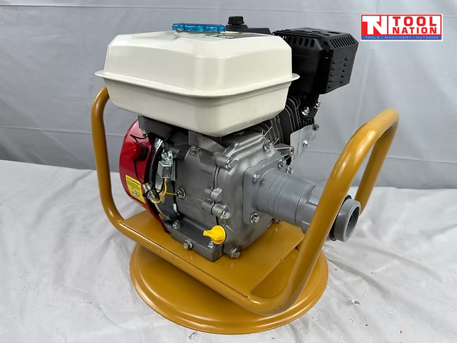 Petrol engine mounted in a yellow cradle with white fuel tank, black air filter cover, grey coupling, and logo in the top corner.