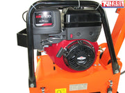 Close-up of a petrol engine mounted on an orange plate compactor with protective frame and warning labels.