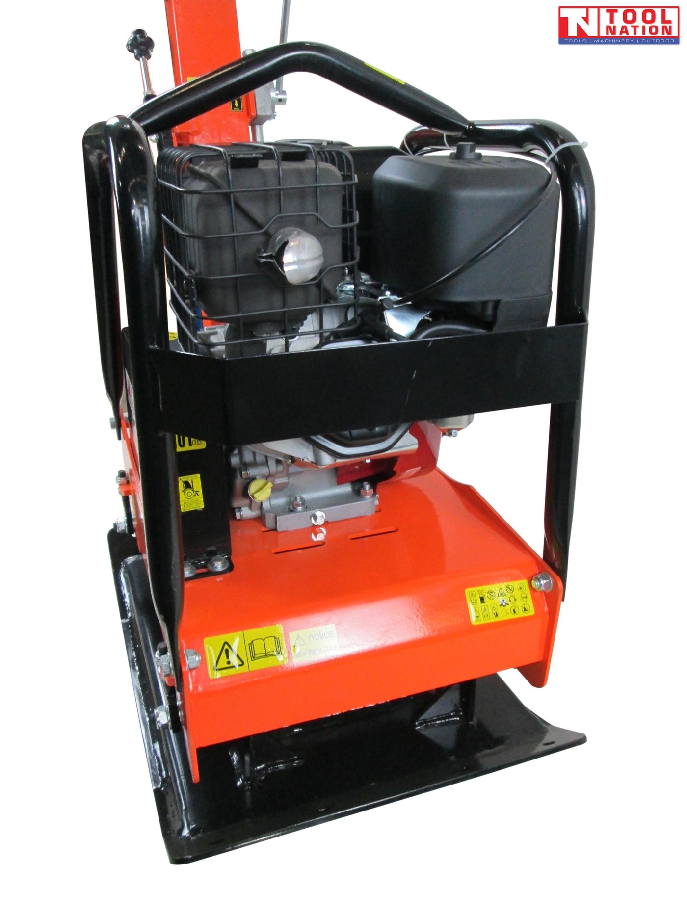 Rear view of an orange plate compactor with petrol engine, protective frame, black base plate, handle, and warning labels.