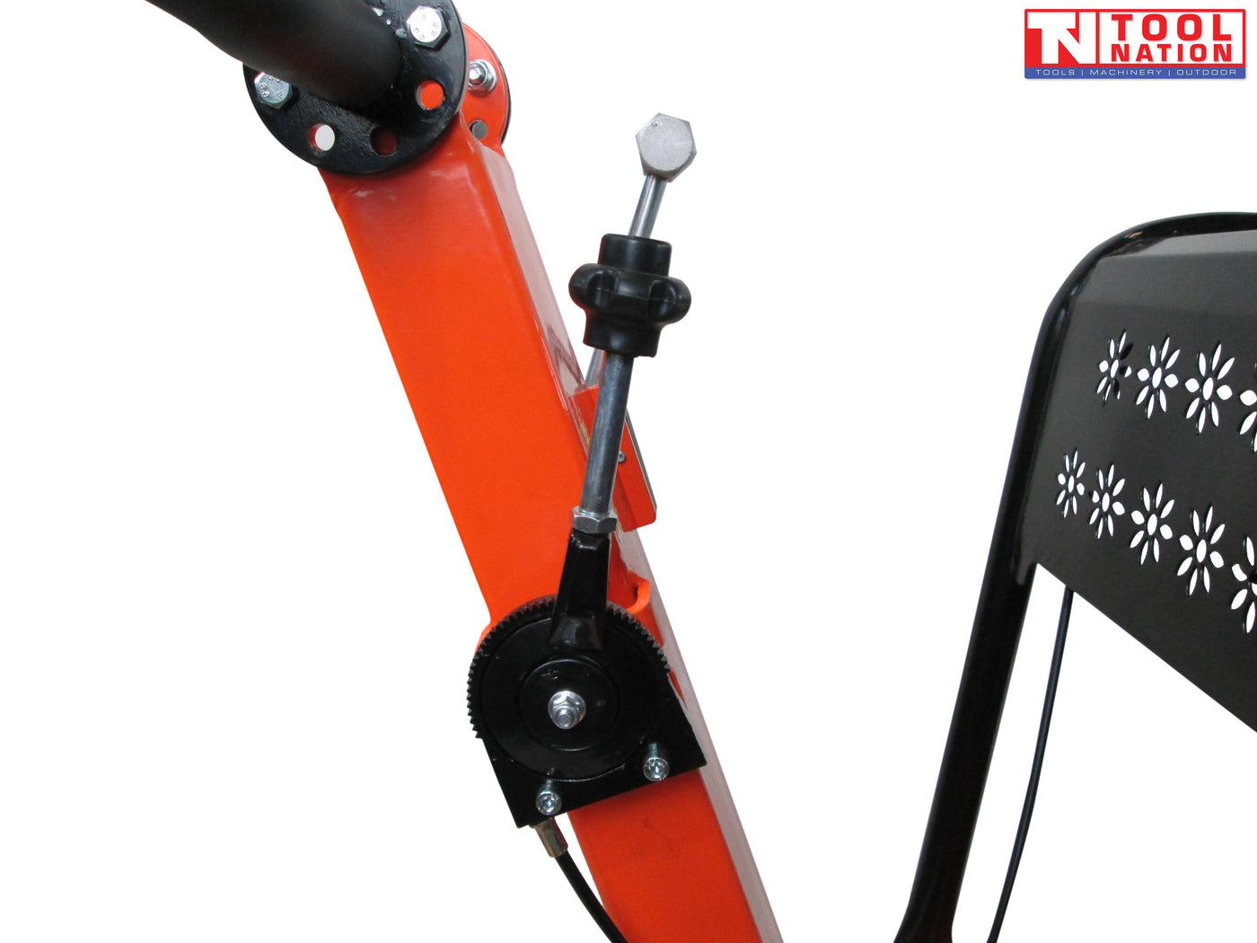 Close-up of an orange plate compactor handle showing the control lever, black adjustment knob, cable, and protective frame.