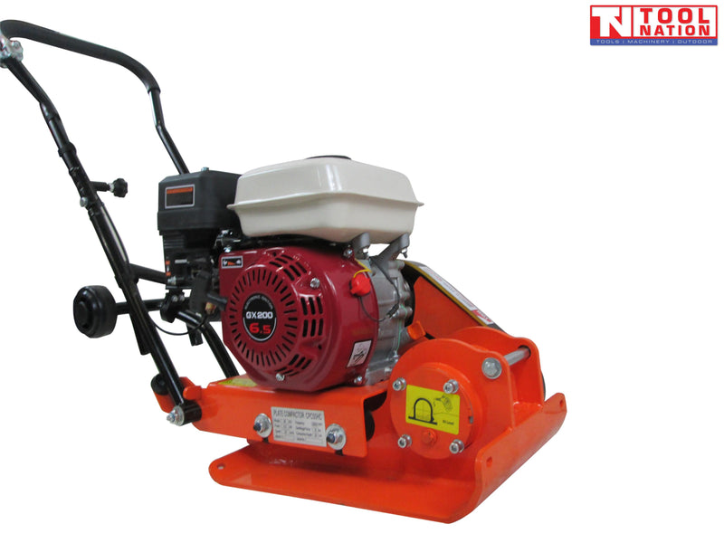 Orange plate compactor with petrol engine, black handle, wheels, warning labels, and logo in the top corner.