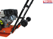 Close-up rear view of an orange plate compactor showing the petrol engine, black belt cover, handle frame, wheels, and logo in the top corner.