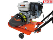 Close-up side view of an orange plate compactor showing the petrol engine, black belt cover, base plate, wheel, and logo in the top corner.