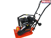 Rear angled view of an orange plate compactor with petrol engine, black handle, wheels, protective frame, base plate, and logo in the top corner.