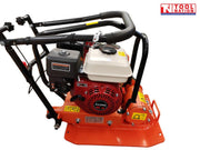 Orange plate compactor with petrol engine, black handle, base plate, warning labels, and logo in the top corner.
