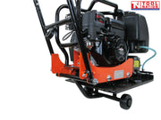 Rear angled view of an orange plate compactor with petrol engine, black water tank, handle frame, wheel kit, base plate, and logo in the top corner.