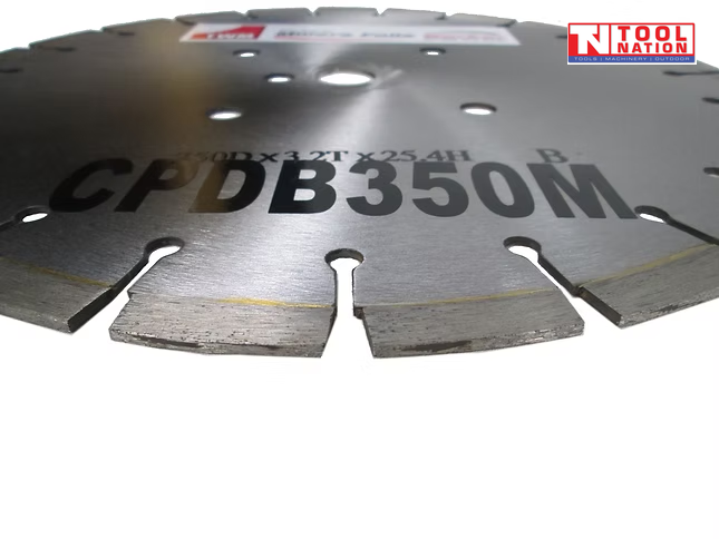 Close-up of a silver segmented diamond cutting blade showing printed model text, centre holes, and logo in the top corner.