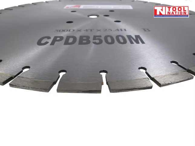 Close-up of a silver segmented diamond cutting blade showing the cutting edge, centre holes, printed text, and logo in the top corner.