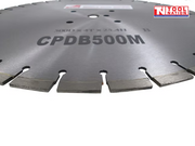 Close-up of a silver segmented diamond cutting blade showing the cutting edge, centre holes, printed text, and logo in the top corner.