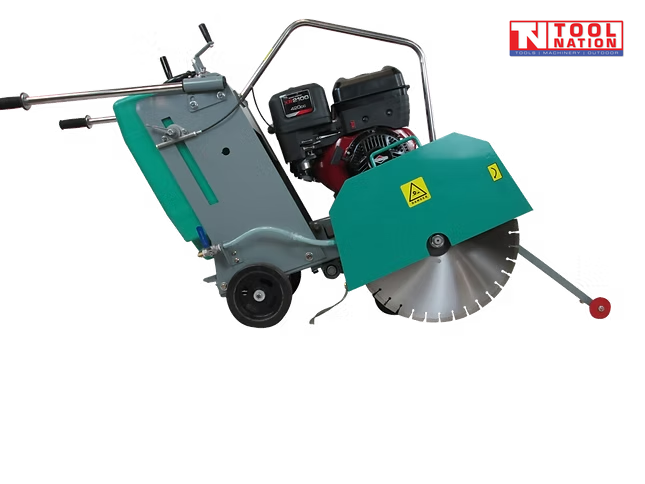 Teal and grey floor saw with petrol engine, blade guard, diamond blade, wheels, handle, and pointer arm.