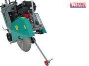 Front angled view of a teal and grey floor saw with petrol engine, blade guard, diamond blade, wheels, and pointer arm.