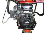 Close-up of a petrol engine on a tamping rammer showing the pull start, air filter, fuel components, frame, and logo in the top corner.