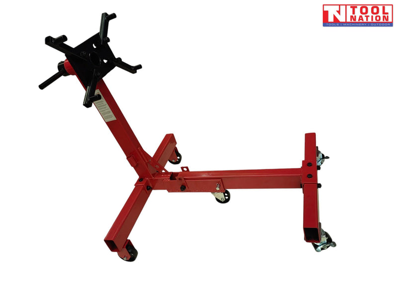 Foldable engine stand side view with red frame, black mounting head, handle, and casters