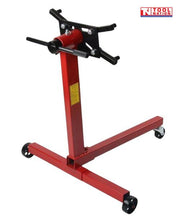 Engine stand rear angled view with red frame, black mounting head, handle, and casters