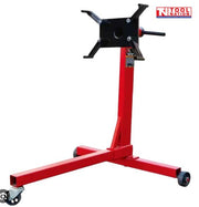 Engine stand angled view with red frame, black mounting head, handle, and casters