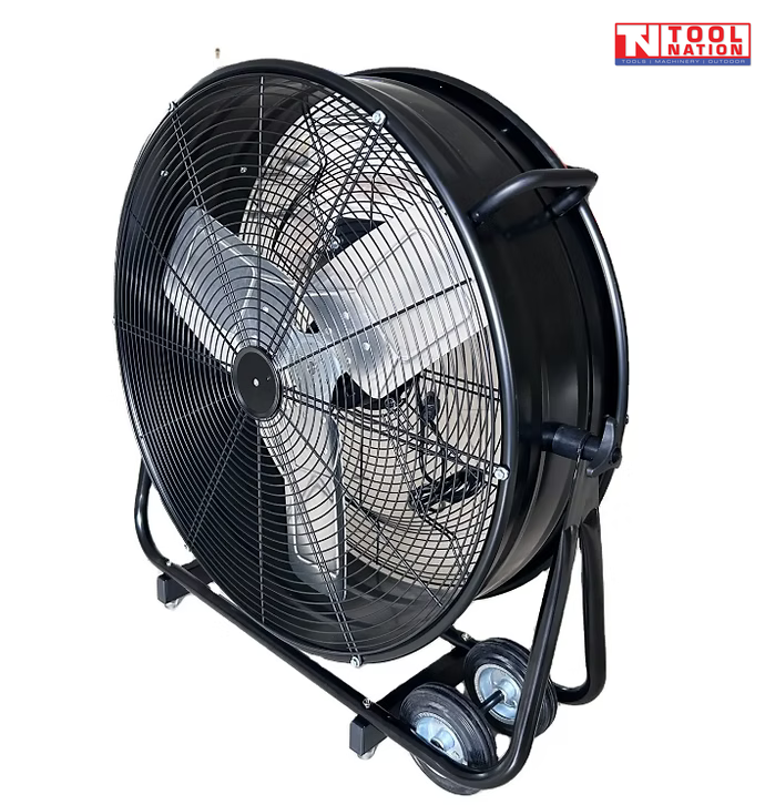 Angled view of a black drum fan with front grille, silver blades, tubular frame, and wheels.