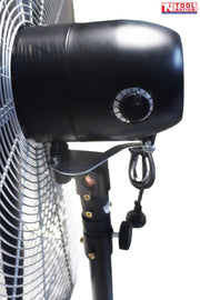 Angled view of a large pedestal fan showing round grille, three blades, adjustable stand, and cross base.