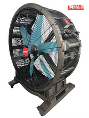 Angled view of a large floor fan with black grille, blue blades, rear controls, power cord, and caster wheels.