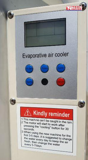 Close-up of an evaporative air cooler control panel with display, buttons, and reminder label.