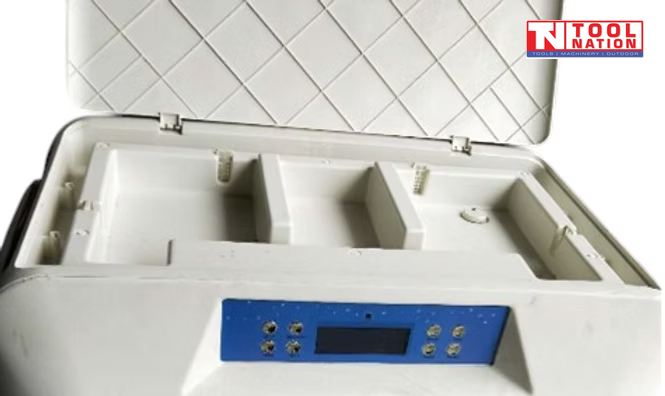 Top close-up of an evaporative air cooler with open lid, compartments, and blue control panel.