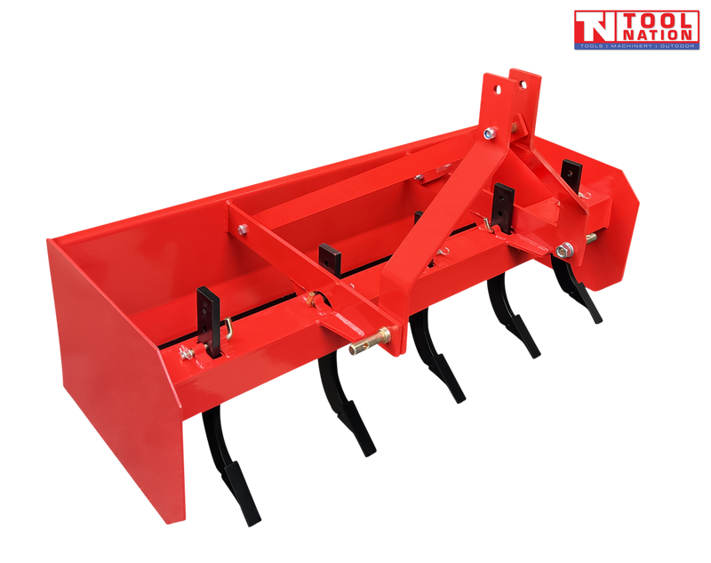 Red box grader attachment with black ripper tines, triangular mounting frame, pins, bolts, and a logo in the top right corner.
