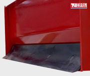 Close-up of a red box grader panel with a black lower cutting edge and logo in the top right corner.