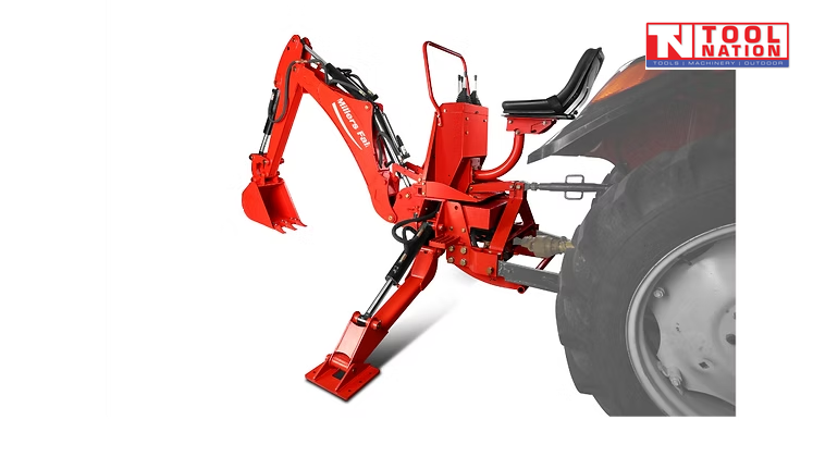 Red backhoe attachment connected behind a tractor, showing the seat, bucket, stabiliser leg, and rear tractor wheel.