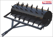 Black towable spiked roller with a rectangular frame, drawbar, metal pin and Tool Nation logo.