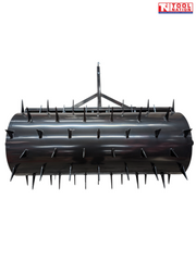 Close front view of a black spiked roller with a frame and drawbar visible behind it.