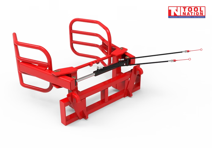Rear angled view of a red bale gripper with curved gripping arms, rectangular mounting frame, hydraulic hoses, and a logo in the top right corner.