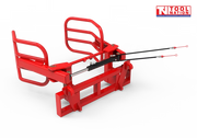 Rear angled view of a red bale gripper with curved gripping arms, rectangular mounting frame, hydraulic hoses, and a logo in the top right corner.