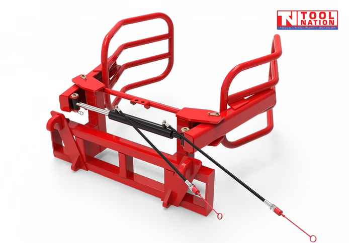 Rear view of a red bale gripper with curved gripping arms, rectangular mounting frame, hydraulic hoses, and a logo in the top right corner.