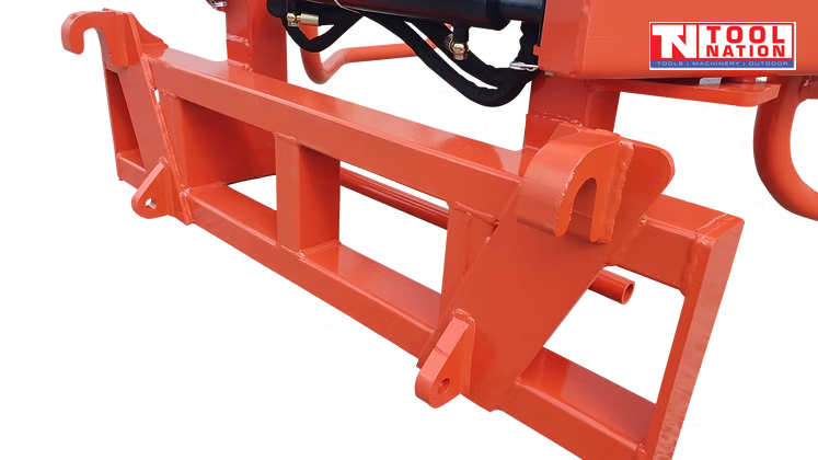 Close-up of the red mounting frame with hook brackets, bolt holes, black hydraulic parts, and logo in the top right corner.