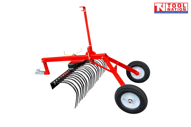 Red towable landscape rake shown from the side with black curved tines, long drawbar, metal coupler, two tyres and Tool Nation logo.