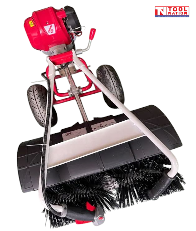 Close top view of a red and white walk-behind power broom showing black brush bristles, black guard, two tyres, engine and handles.