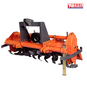 Rear angled view of an orange rotary tiller with black curved tines, black mounting frame, guard rail, support leg, bolts, and a logo in the top right corner.
