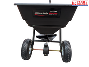 Front view of a black walk-behind spreader with an open hopper, two treaded tyres and Tool Nation logo.
