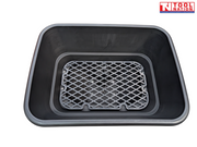 Top view inside a black spreader hopper showing a grey mesh screen fitted at the base.