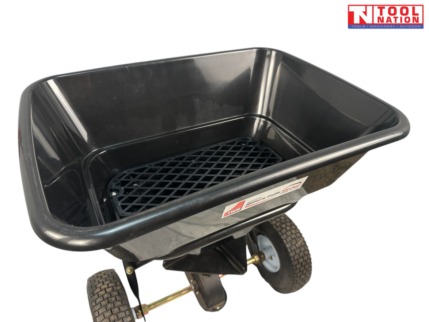 Close-up of a black spreader hopper showing an internal mesh screen, hopper rim, two tyres and Tool Nation logo.